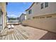 Backyard featuring a trampoline, wooden deck, gravel, and privacy fence at 9039 Alex Creek Ave, Las Vegas, NV 89149