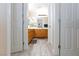 Bathroom with double sinks, wood cabinetry, and tile flooring, providing a functional and stylish space at 9039 Alex Creek Ave, Las Vegas, NV 89149