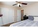 This bedroom features a ceiling fan, closet and a neutral color palette, creating a relaxing atmosphere at 9039 Alex Creek Ave, Las Vegas, NV 89149