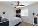 Cozy bedroom with ceiling fan, television, and neutral tones, showcasing a comfortable living space at 9039 Alex Creek Ave, Las Vegas, NV 89149