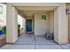 Inviting front porch with a sturdy door, offering a warm welcome to guests and residents at 9039 Alex Creek Ave, Las Vegas, NV 89149