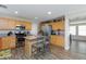 Kitchen with light wood cabinets, stainless steel appliances and granite counters at 9039 Alex Creek Ave, Las Vegas, NV 89149
