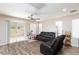 Cozy living area with sliding glass doors, stylish flooring, and natural light at 9039 Alex Creek Ave, Las Vegas, NV 89149