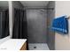 Modern shower with sleek tile, rainfall showerhead, and glass door, providing a luxurious experience at 9039 Alex Creek Ave, Las Vegas, NV 89149