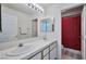 Spacious bathroom featuring a double sink vanity and a separate shower and toilet area at 9348 Buckhaven Dr, Las Vegas, NV 89117