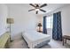 Bright bedroom with a ceiling fan and a large window with patterned curtains at 9348 Buckhaven Dr, Las Vegas, NV 89117