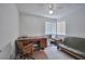 Bright, airy bedroom with a desk and a futon at 9348 Buckhaven Dr, Las Vegas, NV 89117