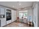 Eat-in kitchen area with tile floors and plenty of natural light offers a cozy dining space at 9348 Buckhaven Dr, Las Vegas, NV 89117