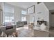 Bright living room with high ceilings, large windows, and tile flooring offers plenty of natural light at 9348 Buckhaven Dr, Las Vegas, NV 89117