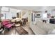 Inviting living room featuring cozy seating, tile floors, and a charming view into the kitchen at 9348 Buckhaven Dr, Las Vegas, NV 89117