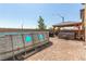 Backyard with above ground pool, brick patio, barbecue, hot tub and a wooden pergola at 9690 Langden Brook St, Las Vegas, NV 89178