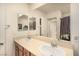 Bathroom featuring a double sink vanity and a large mirror, offering a clean and functional space at 9690 Langden Brook St, Las Vegas, NV 89178