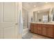 Bathroom featuring double sinks and a shower-tub combination at 9690 Langden Brook St, Las Vegas, NV 89178