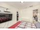 Bedroom featuring a TV, with view to the closet and entrance to another room at 9690 Langden Brook St, Las Vegas, NV 89178