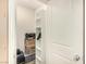 Walk-in closet with shelving, ideal for storage, and a standard closet door at 9690 Langden Brook St, Las Vegas, NV 89178