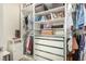 Organized closet featuring shelving, hanging rods, and drawers, offering ample storage space at 9690 Langden Brook St, Las Vegas, NV 89178