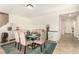 Dining area featuring a glass table, patterned chairs, and built-in buffet at 9690 Langden Brook St, Las Vegas, NV 89178