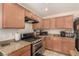 Close up shot of kitchen with stainless steel range and granite counters at 9690 Langden Brook St, Las Vegas, NV 89178