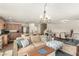 Open-concept living area features a spacious layout, cozy seating, and seamless integration with the kitchen and dining space at 9690 Langden Brook St, Las Vegas, NV 89178