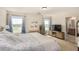 Spacious main bedroom featuring a king bed and serene backyard views at 9690 Langden Brook St, Las Vegas, NV 89178