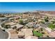 Aerial view of the property with a lush backyard, desert landscaping, and a view of the city at 983 Cutter St, Henderson, NV 89011