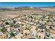 A sweeping view from above captures a neighborhood of single-Gathering homes under a clear blue sky at 983 Cutter St, Henderson, NV 89011