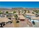 Aerial view of the home showcasing desert landscaping, a three car garage, and tile roof at 983 Cutter St, Henderson, NV 89011