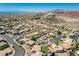 Panoramic shot of a residential neighborhood surrounded by desert terrain with a city skyline on the horizon at 983 Cutter St, Henderson, NV 89011