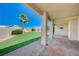 View of the backyard with an artificial turf and covered patio at 983 Cutter St, Henderson, NV 89011