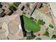 A well-kept backyard features a manicured lawn, covered patio, and stone paver accents at 983 Cutter St, Henderson, NV 89011