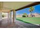 Spacious backyard features an artificial turf and extended covered patio at 983 Cutter St, Henderson, NV 89011