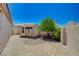 Private backyard featuring a storage shed, mature landscaping, and brick-paved patio at 983 Cutter St, Henderson, NV 89011
