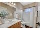 Well-lit bathroom featuring a shower-tub combination and modern fixtures at 983 Cutter St, Henderson, NV 89011