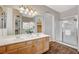 Bathroom featuring a walk-in shower and double sinks and large mirror at 983 Cutter St, Henderson, NV 89011