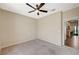 A comfortable, neutral-toned bedroom with ceiling fan and carpeted floors at 983 Cutter St, Henderson, NV 89011