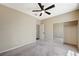 Neutral bedroom with carpeted floors, ceiling fan, and a mirrored closet at 983 Cutter St, Henderson, NV 89011