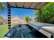 Relax in this backyard hot tub surrounded by lush landscaping at 983 Cutter St, Henderson, NV 89011