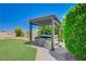 Outdoor hot tub with pergola in backyard with artificial turf at 983 Cutter St, Henderson, NV 89011