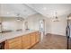 Open kitchen featuring a large island with a granite countertop and space for dining at 983 Cutter St, Henderson, NV 89011