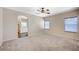 Spacious primary bedroom with a ceiling fan and private ensuite bathroom at 983 Cutter St, Henderson, NV 89011