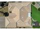 Overhead shot of a clay tiled roof with a well-kept lawn, patio, and garden below at 983 Cutter St, Henderson, NV 89011