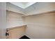 Walk-in closet featuring white-painted wood trim and shelving at 983 Cutter St, Henderson, NV 89011