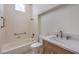 Bathroom features a bathtub with grab bars and a single sink vanity at 10421 Linfield Pl, Las Vegas, NV 89134