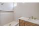 This bathroom features modern cabinets, a textured wall, and a walk-in shower at 10421 Linfield Pl, Las Vegas, NV 89134