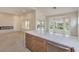 Open kitchen with a spacious island, great for entertaining, and a modern electric cooktop at 10421 Linfield Pl, Las Vegas, NV 89134