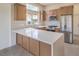 Well-equipped kitchen with stainless appliances, stone countertops, and custom cabinets at 10421 Linfield Pl, Las Vegas, NV 89134