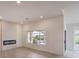 Bright living room with modern fireplace and large windows offering great views at 10421 Linfield Pl, Las Vegas, NV 89134