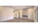 Open floor plan living room featuring an electric fireplace and natural light at 10421 Linfield Pl, Las Vegas, NV 89134