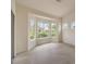 Bright, airy living room featuring a wall of windows, providing abundant natural light and backyard views at 10421 Linfield Pl, Las Vegas, NV 89134