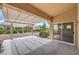 Covered patio area is perfect for outdoor seating and overlooks the community landscape at 10421 Linfield Pl, Las Vegas, NV 89134